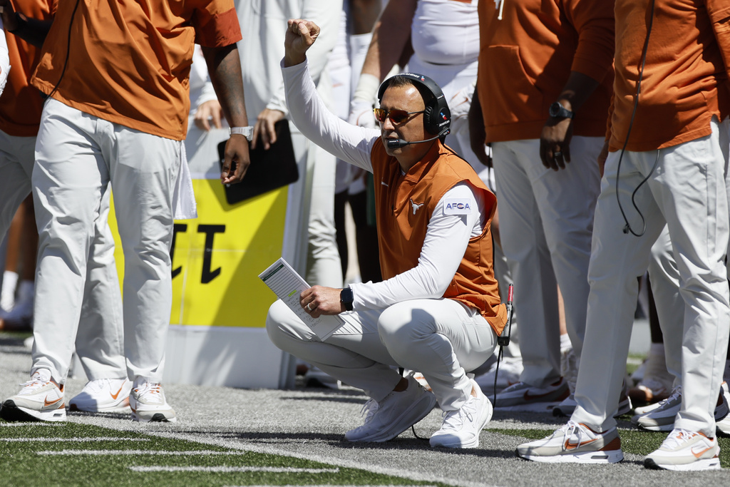 Texas head coach Steve Sarkisian signals to his players during the first half of an NCAA college football game against Ohio State, Saturday, Aug. 30, 2025, in Columbus, Ohio. (AP Photo/Jay LaPrete)