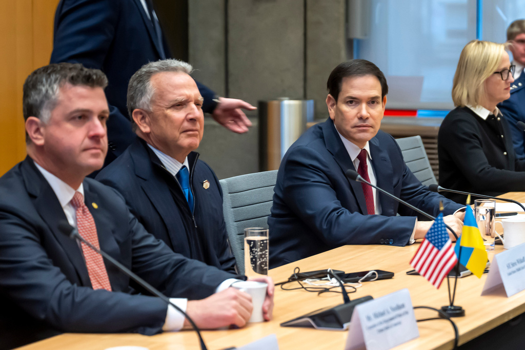 U.S. special envoy Steve Witkoff, second left, and U.S. Secretary of State Marco Rubio, right, sit at the beginning of talks with the Ukrainian delegation at the U.S. Mission to International Organizations in Geneva, Sunday, Nov. 23, 2025. (Martial Trezzini/Keystone via AP)
