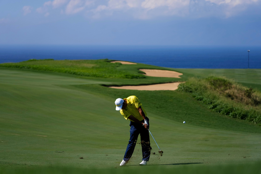 FILE - Hideki Matsuyama, of Japan, hits on the 13th hole during the final round of The Sentry golf event, Jan. 5, 2025, at Kapalua Plantation Course, in Kapalua, Hawaii. (AP Photo/Matt York, File)