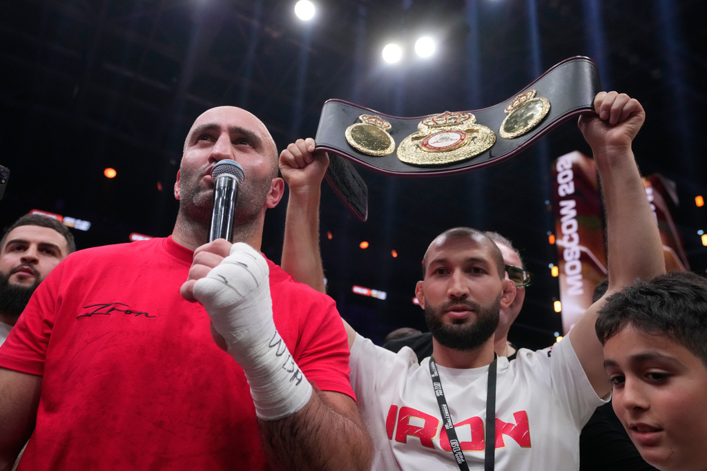 Russia's Murat Gassiev, right, celebrates after defeating Germany's Peter Kadiru during a WBA Heavyweight world title boxing match as part of the IBA Pro 19 event in Moscow, Russia, Saturday, July. 11, 2026. (AP Photo/Pavel Bednyakov)
