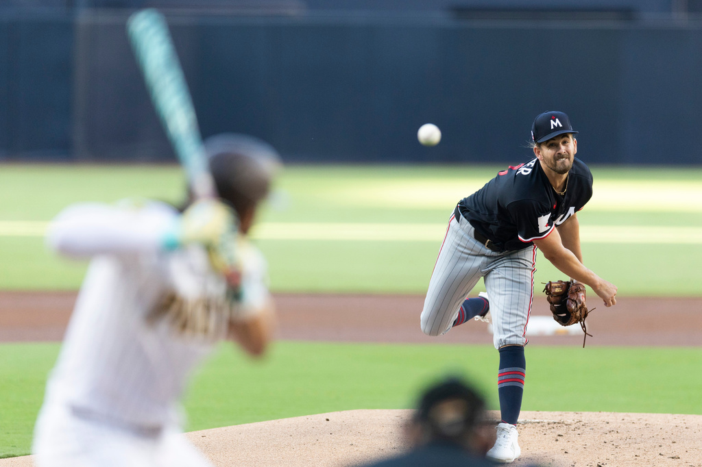 Minnesota Twins starting pitcher Dean Kremer works against San Diego Padres' Fernando Tatis Jr. in the first inning of a baseball game Saturday, Aug. 22, 2026, in San Diego, Calif. (AP Photo/Karl Anderson)
