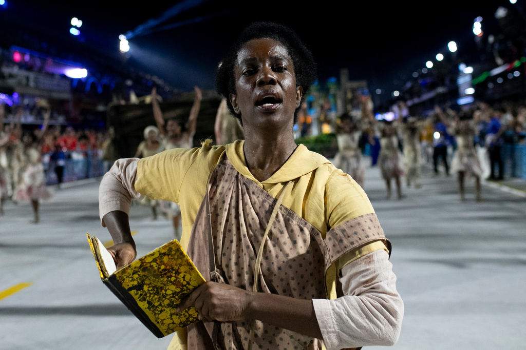 A performer from the Unidos da Tijuca samba school parades during Carnival celebrations at the Sambadrome in Rio de Janeiro, early Tuesday, Feb. 17, 2026. (AP Photo/Bruna Prado)