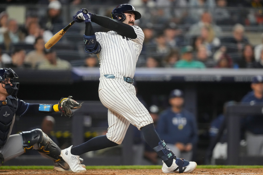 New York Yankees' Austin Wells hits a home run during the fifth inning of a baseball game against the Tampa Bay Rays, Friday, May 22, 2026, in New York. (AP Photo/Yuki Iwamura)