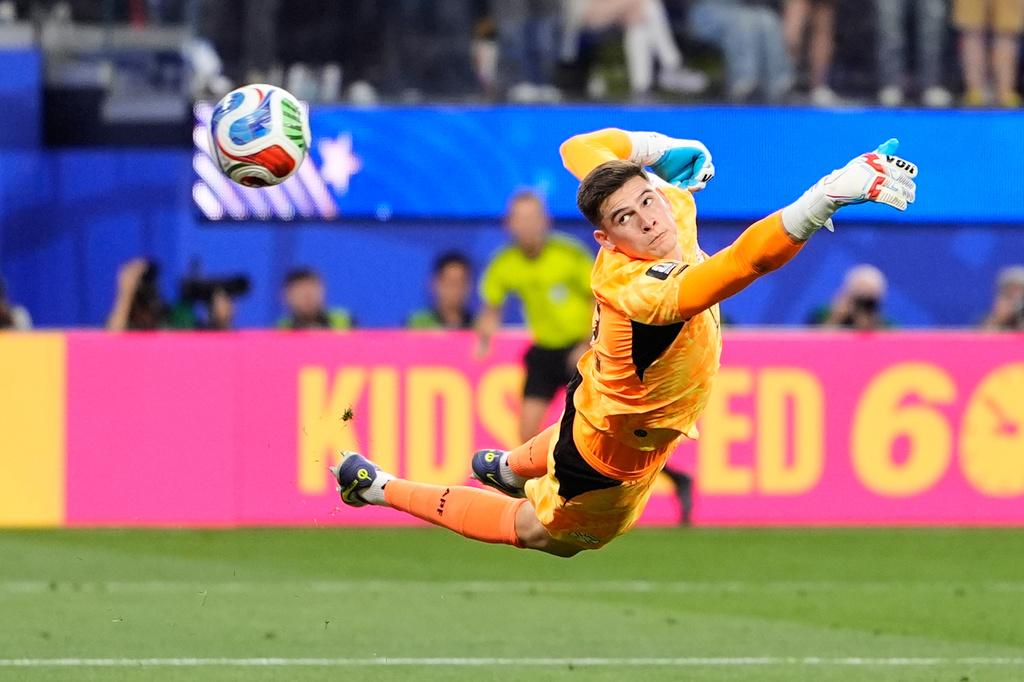 Paraguay goalkeeper Orlando Gill is airborne as he fails to stop a goal from United States' Giovanni Reyna during the World Cup Group D soccer match between the United States and Paraguay in Inglewood, Calif., near Los Angeles, Friday, June 12, 2026. (AP Photo/Mark J. Terrill)