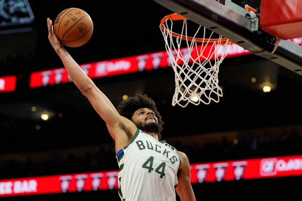 Milwaukee Bucks guard Andre Jackson Jr. (44) dunks against the Atlanta Hawks during the second half of an NBA basketball game, Saturday, March 14, 2026, in Atlanta. (AP Photo/Mike Stewart)