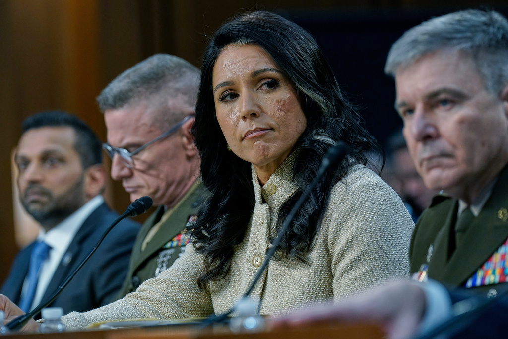 From left, FBI Director Kash Patel, Defense Intelligence Agency Director James Adams III, Director of National Intelligence Tulsi Gabbard, and Acting Commander of the U.S. Cyber Command William Hartman, listen during the Senate Committee on Intelligence hearings to examine worldwide threats on Capitol Hill Wednesday, March 18, 2026, in Washington. (AP Photo/Jose Luis Magana)