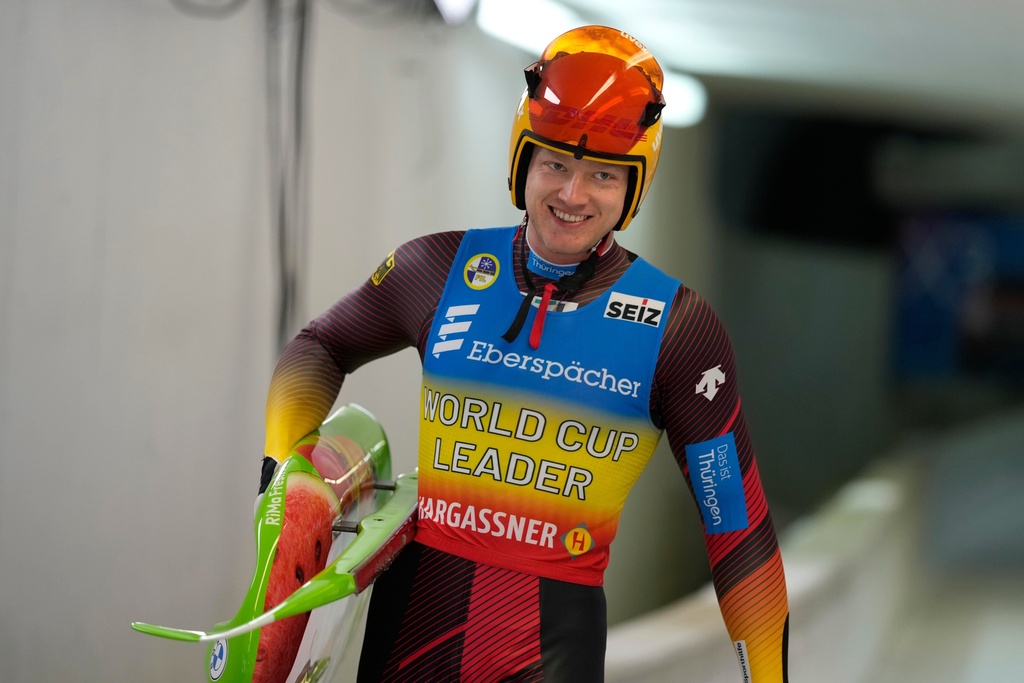 FILE - Max Langenhan of Germany smiles after the men's sprint race at the Luge World Cup in Igls near Innsbruck, Austria, Sunday, Dec. 8, 2024. (AP Photo/Matthias Schrader, File)