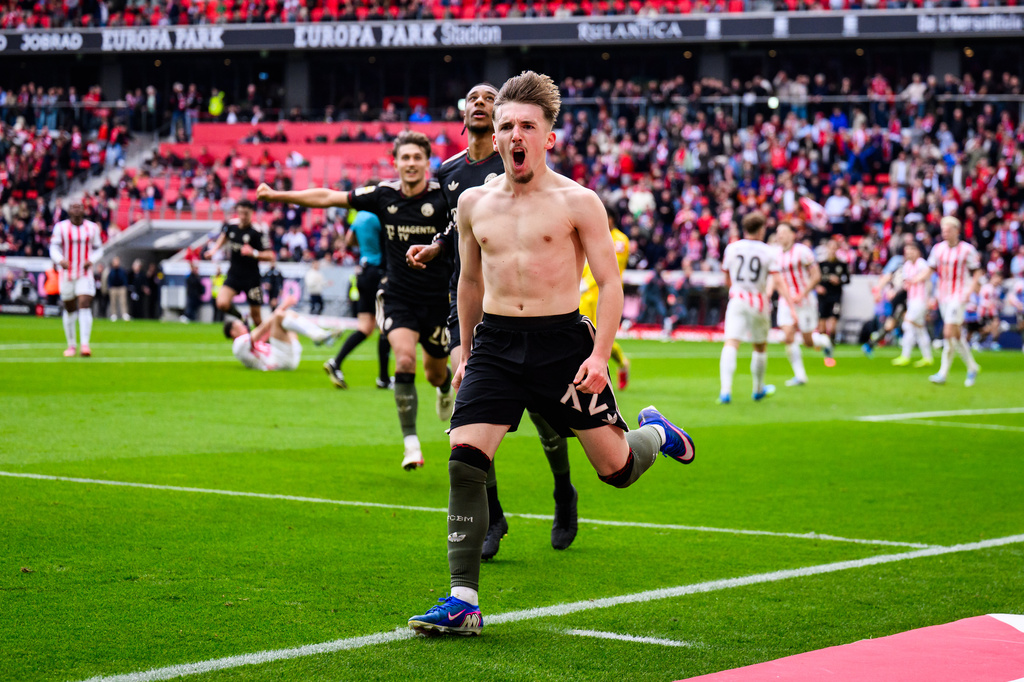 Bayern's Lennart Karl celebrates after scoring during the German Bundesliga soccer match between SC Freiburg and Bayern Munich in Freiburg im Breisgau, Germany, Saturday, April 4, 2026. (Tom Weller/dpa via AP)