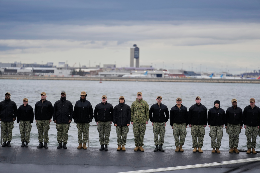 Sailors stand at attention on the USS Massachusetts during a rehearsal ahead of the commissioning of the Navy's newest nuclear-powered attack submarine, Friday, March 27, 2026, in Boston. (AP Photo/Robert F. Bukaty)