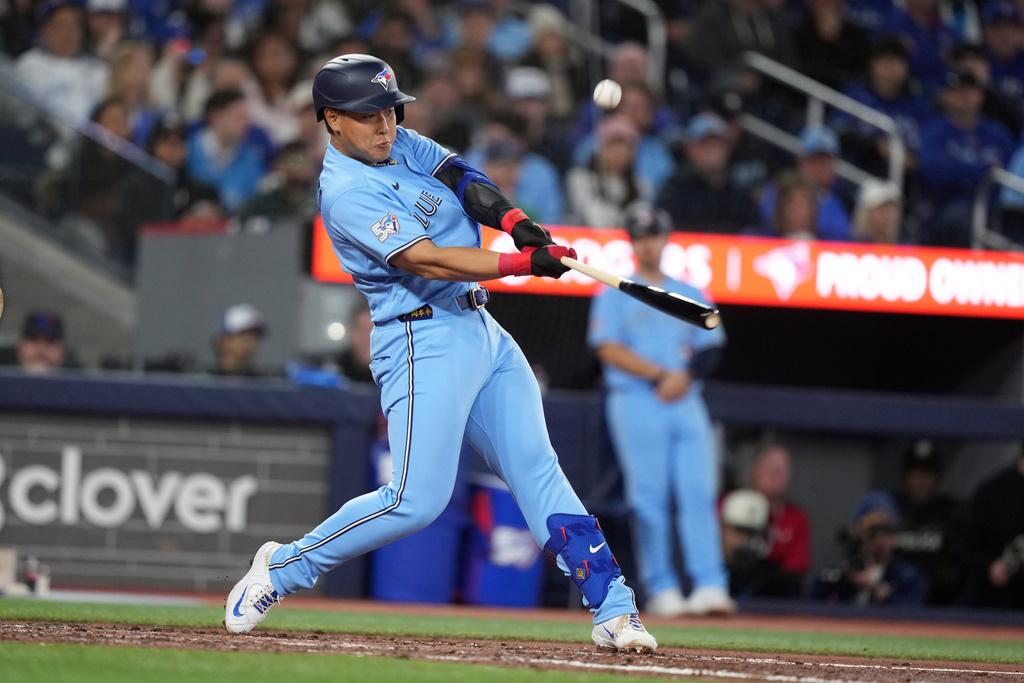 Toronto Blue Jays third baseman Kazuma Okamoto (7) pops out against the Los Angeles Dodgers during the sixth inning of a baseball game in Toronto, Wednesday, April 8, 2026. (Nathan Denette/The Canadian Press via AP)