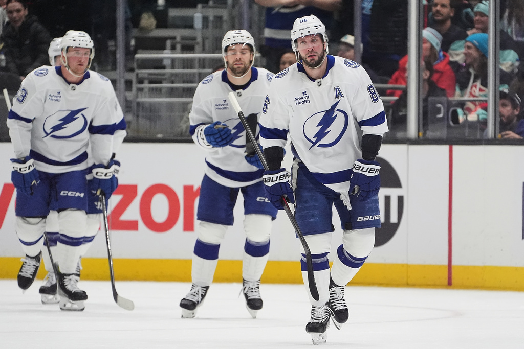 Tampa Bay Lightning right wing Nikita Kucherov skates to greet the bench after scoring against the Seattle Kraken during the first period of an NHL hockey game Tuesday, March 17, 2026, in Seattle. (AP Photo/Lindsey Wasson)