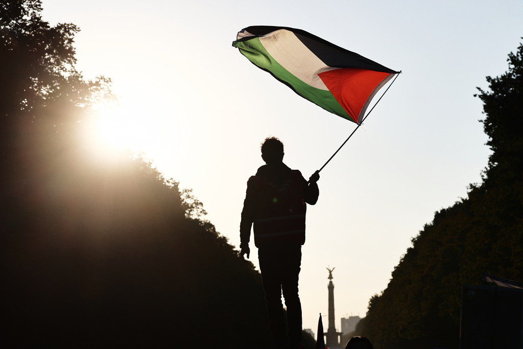 People protest against Israel during a mass demonstration called "All Eyes on Gaza" in support of Palestinians in Berlin, Germany, Saturday, Sept. 27, 2025. (AP Photo/Christoph Soeder)