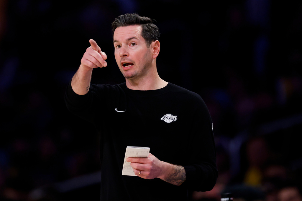 Los Angeles Lakers head coach JJ Redick gestures to players during the first half of an NBA basketball game, Tuesday, Feb. 24, 2026, in Los Angeles. (AP Photo/Caroline Brehman)