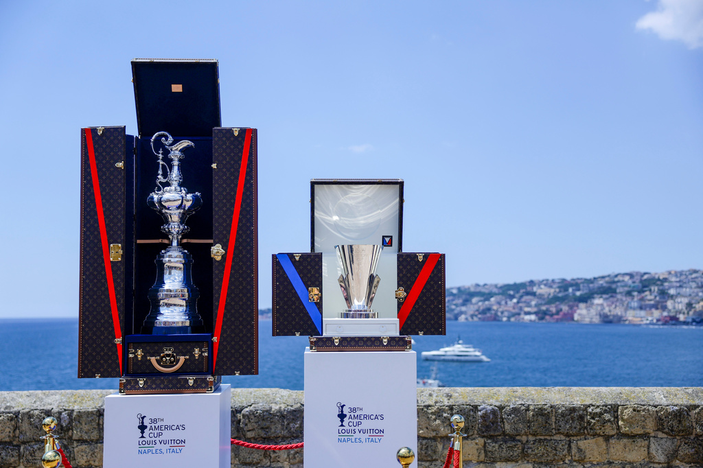 FILE - The America's Cup trophy, left, and Louis Vuitton Cup trophies are seen during the presentation of the 38th America's Cup, at the Castel dell'Ovo in Naples, southern Italy, Wednesday, May 28, 2025. (Alessandro Garofalo/LaPresse via AP, File).