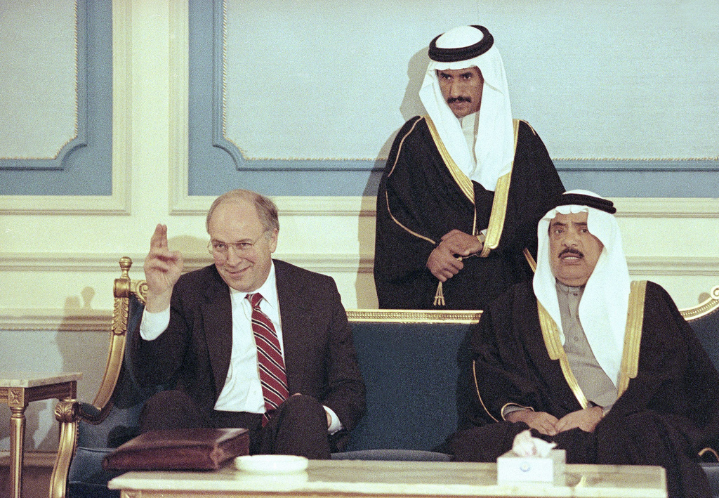 FILE - Secretary of Defense Dick Cheney waves during a reception at an airbase in Riyadh, central Saudi Arabia, Feb. 8, 1991 as he meets with Saudi Assistant Minister of Defense Utman Al Hamaide. Cheney and Chairman of the Joint Chiefs of Staff Colin Powell are in Saudi Arabia to assess the Gulf War. (AP Photo/John Gaps III, file)
