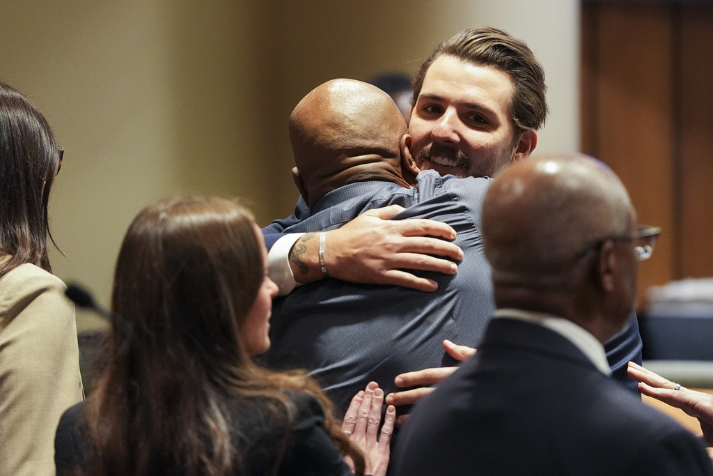 Hernandez Govan, accused of orchestrating the killing of rapper Young Dolph, hugs a member of his defense team in the courtroom after being acquitted on all charges Thursday, Aug. 21, 2025 in Memphis, Tenn. (Chris Day/Commercial Appeal/USA Today Network via Pool)