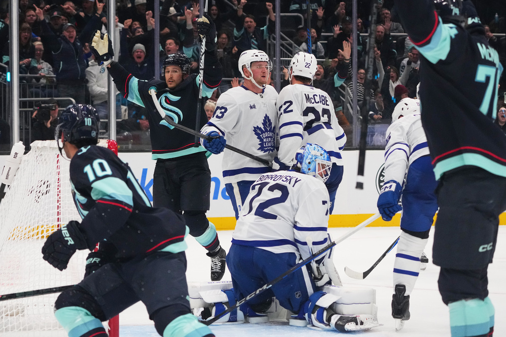 Seattle Kraken defenseman Brandon Montour, second from left, celebrates after making the game-winning goal late during the third period of an NHL hockey game against Toronto Maple Leafs goaltender Sergei Bobrovsky (72), Wednesday, Oct. 28, 2026, in Seattle. (AP Photo/Lindsey Wasson)