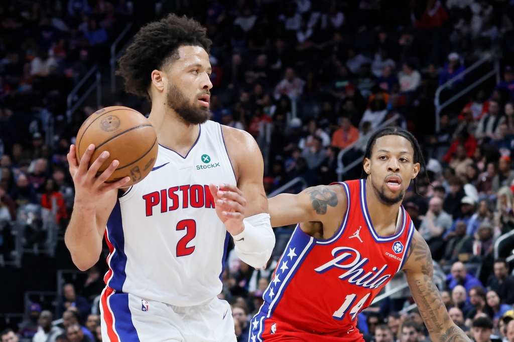 Detroit Pistons guard Cade Cunningham (2) drives to the basket against Philadelphia 76ers forward Dalen Terry (14) during the second half of an NBA basketball game, Thursday, March 12, 2026, in Detroit. (AP Photo/Duane Burleson)
