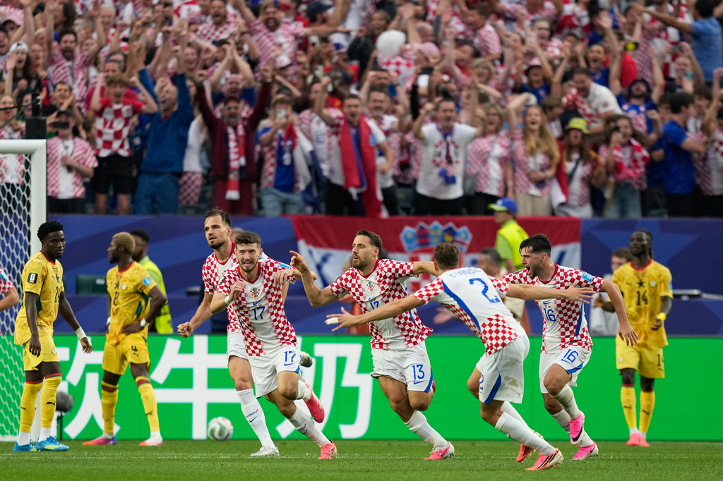 Croatia's Nikola Vlasic (13) celebrates with teammates after scoring his side's second goal during the World Cup Group L soccer match between Croatia and Ghana in Philadelphia, Saturday, June 27, 2026. (AP Photo/Matt Slocum)