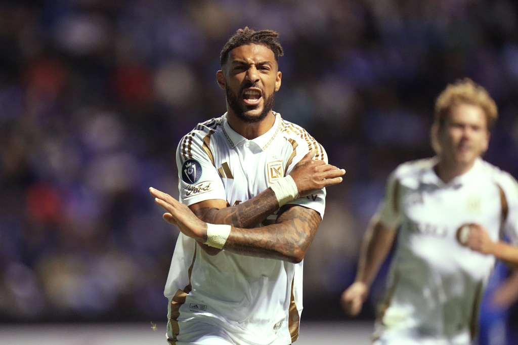 Denis Bouanga of the United States' Los Angeles FC celebrates scoring his side's first goal from the penalty spot against Mexico's Cruz Azul during a CONCACAF Champions Cup quarterfinal second leg soccer match in Puebla, Mexico, Tuesday, April 14, 2026. (AP Photo/Eduardo Verdugo)