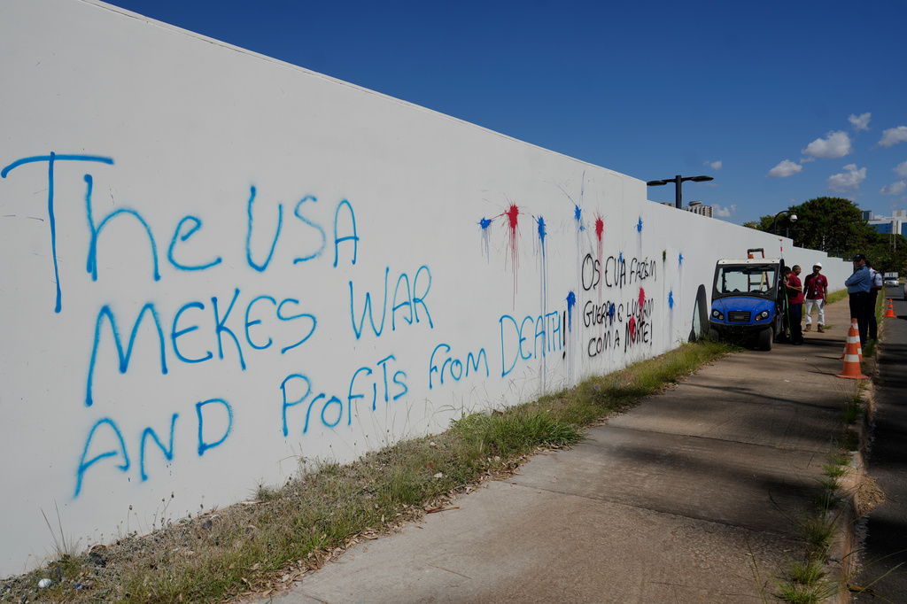 Protest graffiti covers a wall of the U.S. Embassy in Brasília, Brazil, Thursday, Aug. 13, 2026. (AP Photo/Eraldo Peres)
