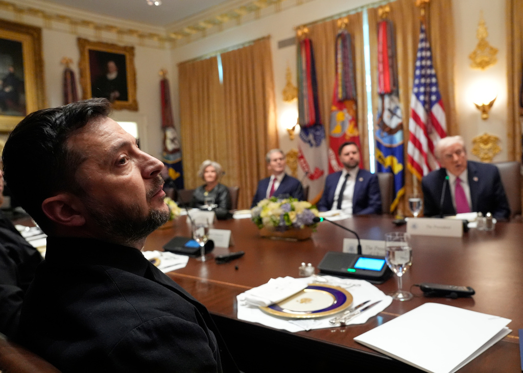 President Donald Trump, right, speaks before a lunch with Ukraine's President Volodymyr Zelenskyy, from left, as White House Chief of Staff Susie Wiles, Treasury Secretary Scott Bessent and Vice President JD Vance listen in the Cabinet Room of the White House, Friday, Oct. 17, 2025, in Washington. (AP Photo/Alex Brandon)
