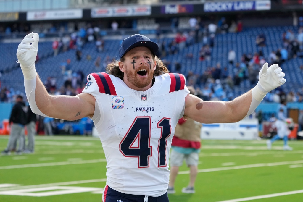 New England Patriots safety Brenden Schooler (41) celebrates following an NFL football game against the Tennessee Titans, Sunday, Oct. 19, 2025, in Nashville, Tenn. (AP Photo/George Walker IV)
