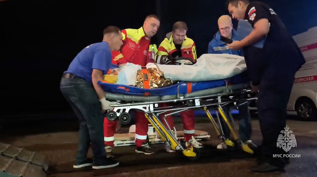 In this image made from video provided by Russian Emergency Situations Ministry press service, medical and rescue workers put those injured in a fire at the Amur Gas Chemical Complex on a plane to Moscow in Blagoveschensk, Amur region, Russia, Thursday, Aug. 27, 2026. (Ministry of Emergency Situations press service via AP)