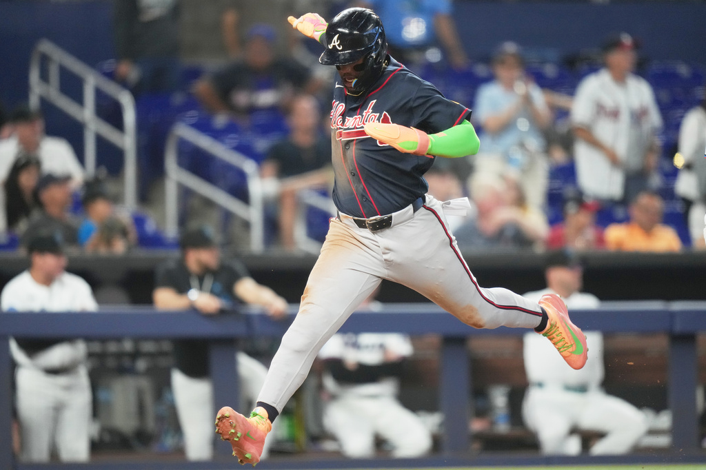 Atlanta Braves' Ronald Acuna runs to score on a single hit by Matt Olson during the eighth inning of a baseball game against the Miami Marlins, Tuesday, May 19, 2026, in Miami. (AP Photo/Lynne Sladky)