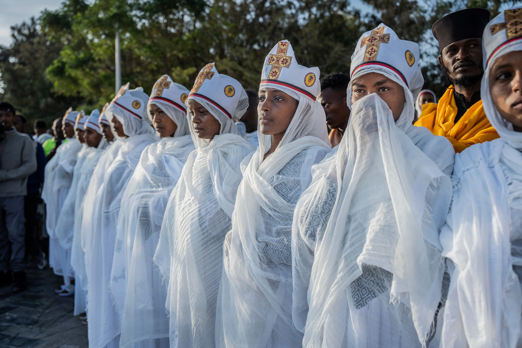 Ethiopian Orthodox devotees attend a prayer during the celebration of the Ethiopian Epiphany on the shore of lake Dembel, in Batu, Ethiopia, Monday, Jan. 19, 2026. (AP Photo/Amanuel Sileshi)