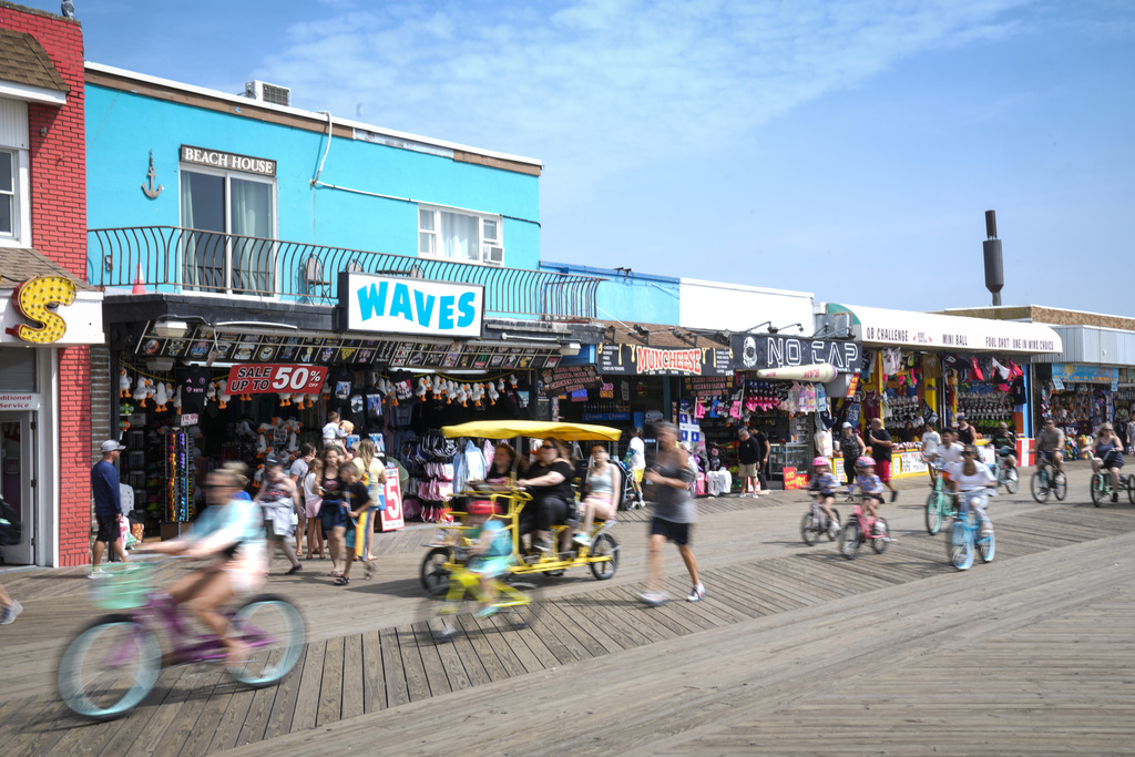 FILE - Small businesses line the boardwalk in Wildwood, N.J., on Aug. 9, 2024. (AP Photo/Matt Rourke, File)