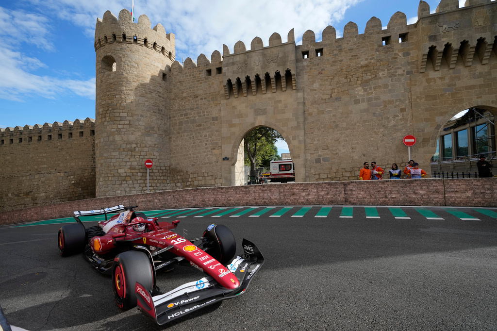 FILE - Ferrari driver Charles Leclerc, of Monaco, steers through a turn during qualifying for the Azerbaijan Formula One Grand Prix auto race in Baku, Azerbaijan, Sept. 20, 2025. (AP Photo/Darko Bandic, File)