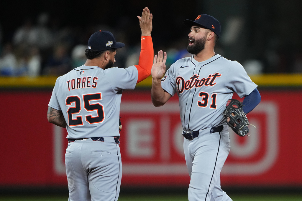 Detroit Tigers left fielder Riley Greene, right, and second baseman Gleyber Torres celebrate after the team's win in Game 1 of baseball's American League Division Series against the Seattle Mariners, Saturday, Oct. 4, 2025, in Seattle. (AP Photo/Lindsey Wasson)
