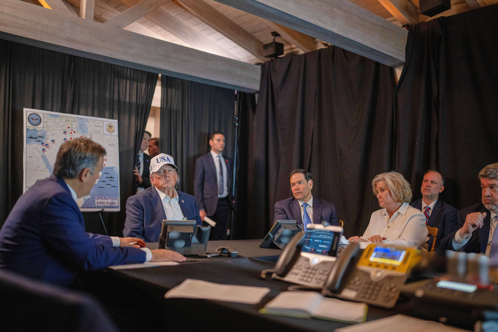 This photo provided by the White House which has been partially blurred, shows President Donald Trump talking with CIA Director John Ratcliffe, left, Secretary of State Marco Rubio, and White House chief of staff Susie Wiles at Mar-a-Lago in Palm Beach, Fla., during Operation Epic Fury on Saturday, Feb. 28, 2026. (Daniel Torok/The White House via AP)