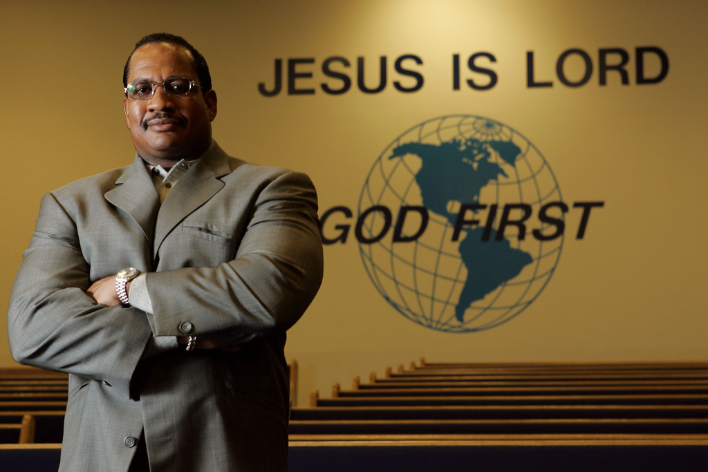 FILE - Pastor Patrick Wooden Sr. is seen in the sanctuary of the Upper Room Church of God in Christ on Dec. 9, 2004, in Raleigh, N.C. (AP Photo/Gerry Broome, File)