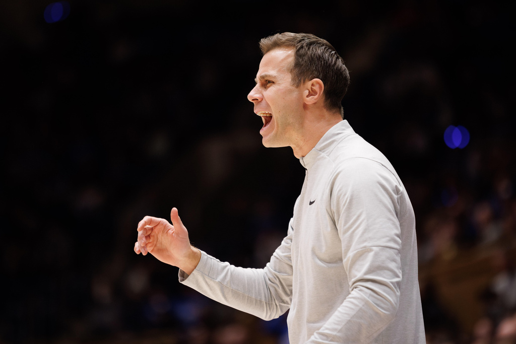 Duke head coach Jon Scheyer directs his team during the first half of an NCAA college basketball game against Lipscomb in Durham, N.C., Tuesday, Dec. 16, 2025. (AP Photo/Ben McKeown)
