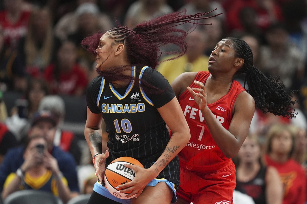 Chicago Sky's Kamilla Cardoso (10) goes to the basket against Indiana Fever's Aliyah Boston (7) during the first half of a WNBA basketball game, Friday, Sept. 5, 2025, in Indianapolis. (AP Photo/Darron Cummings)