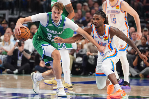 Dallas Mavericks forward Cooper Flagg (32) dribbles against Oklahoma City Thunder guard Cason Wallace, right, during the first half of an NBA basketball game in Dallas, Monday, Oct. 27, 2025. (AP Photo/LM Otero) Dallas Mavericks forward Cooper Flagg (32) dribbles against Oklahoma City Thunder guard Cason Wallace, right, during the first half of an NBA basketball game in Dallas, Monday, Oct. 27, 2025. (AP Photo/LM Otero)