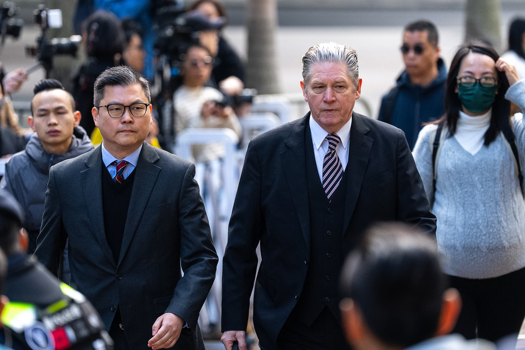 Former Hong Kong publisher Jimmy Lai's lawyers arrive at the West Kowloon Magistrates' Courts ahead of his sentencing, in Hong Kong, Monday, Feb. 9, 2026. (AP Photo/Chan Long Hei)