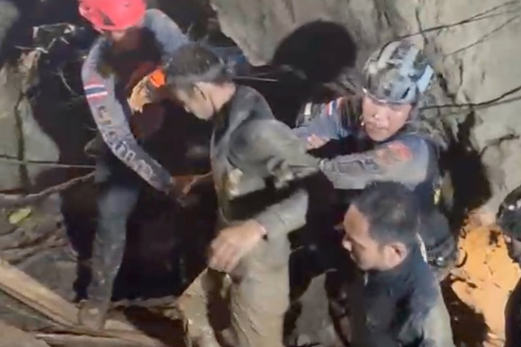 This video grab provided by the Association Of Volunteers For Lao People, shows rescuers evacuating the first of five villagers, center, who had been trapped in a cave in Xaisomboun province, Laos, Friday, May 29, 2026. (Association Of Volunteers For Lao People via AP)