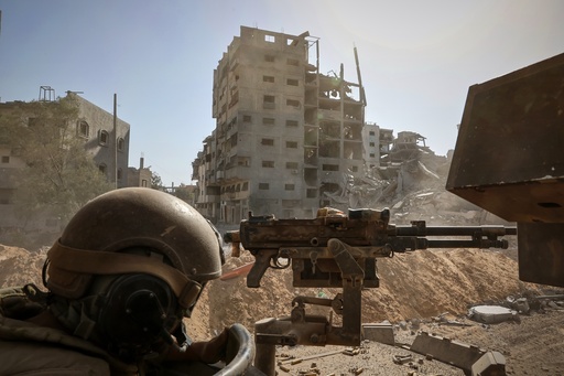 This picture taken during a media tour organised by the Israeli army shows an Israeli army soldier behind a mounted machine gun in the vicinity of the Jordanian Field Hospital in Gaza City, Friday, Oct. 3, 2025. (Jack Guez/Pool Photo via AP) This picture taken during a media tour organised by the Israeli army shows an Israeli army soldier behind a mounted machine gun in the vicinity of the Jordanian Field Hospital in Gaza City, Friday, Oct. 3, 2025. (Jack Guez/Pool Photo via AP)