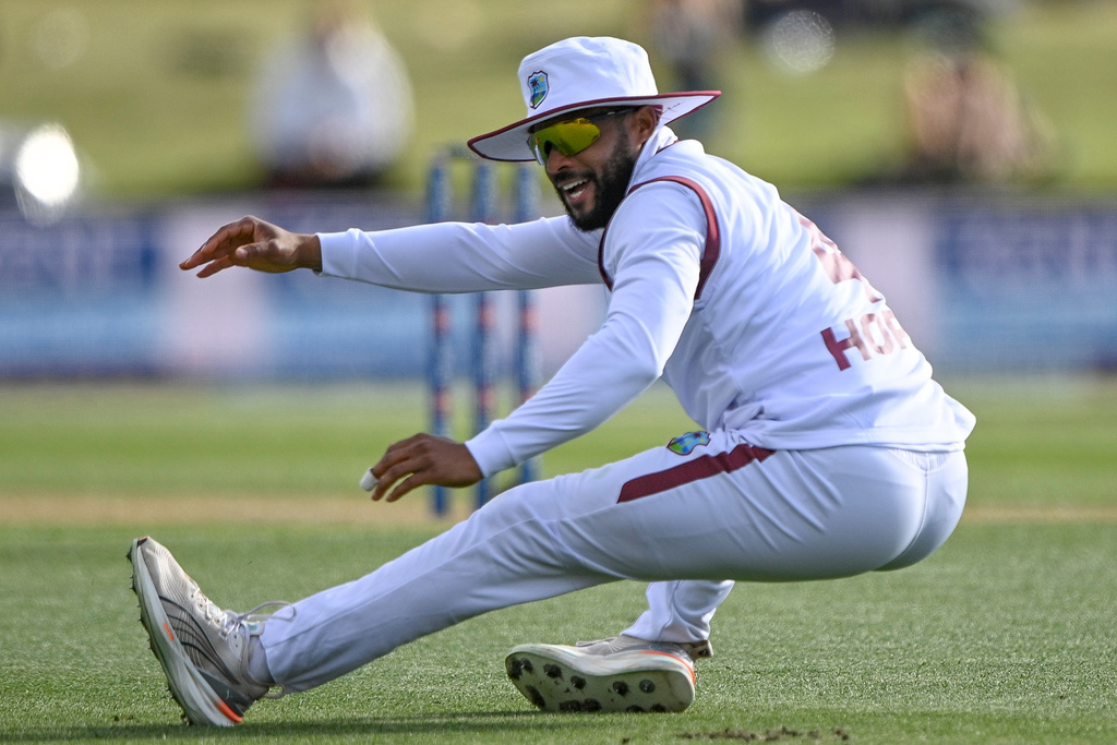 West Indies' Shai Hope falls after attempting to field against New Zealand during their cricket test match in Christchurch, New Zealand, Tuesday, Dec. 2, 2025. (Andrew Cornaga/Photosport via AP)