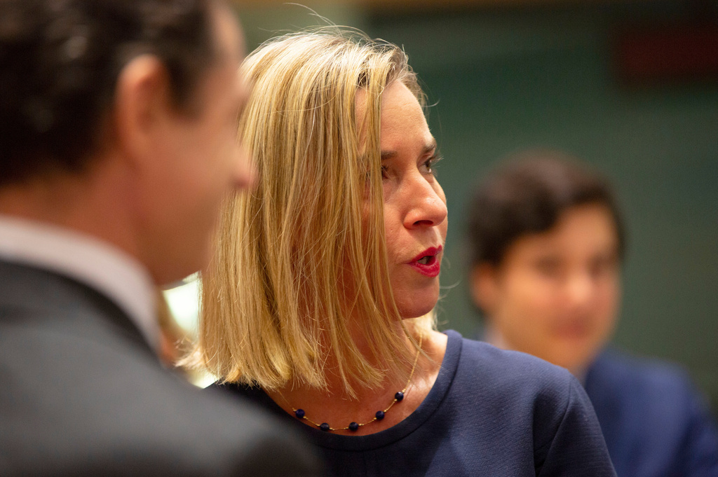 FILE -European Union foreign policy chief Federica Mogherini, right, attends a meeting of EU foreign ministers at the EU Council building in Brussels, Nov. 25, 2019. (AP Photo/Virginia Mayo, File)