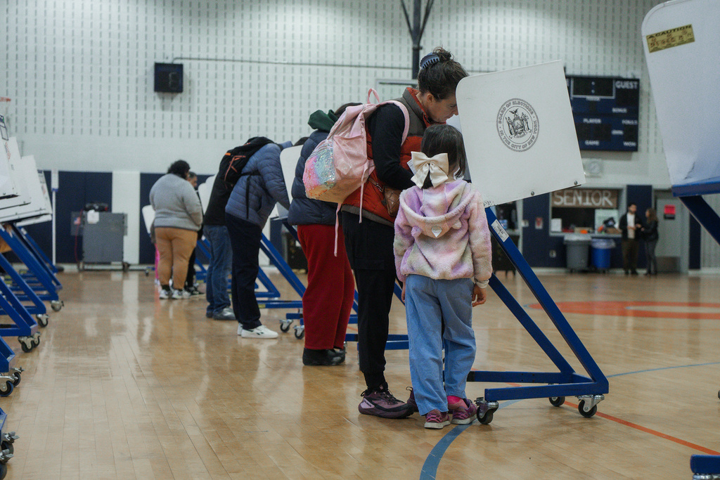 People vote on Election Day on Tuesday, Nov. 4, 2025, in New York. (AP Photo/Olga Fedorova)