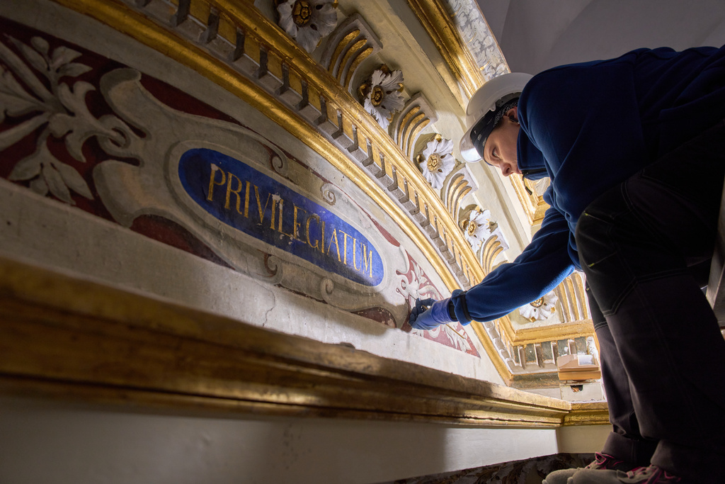Restorer Domiziana Marchioro polishes the altar od St. Sebastian inside the Basilica of San Pietro in Vincoli in Rome, Monday, March 9, 2026. (AP Photo/Domenico Stinellis)
