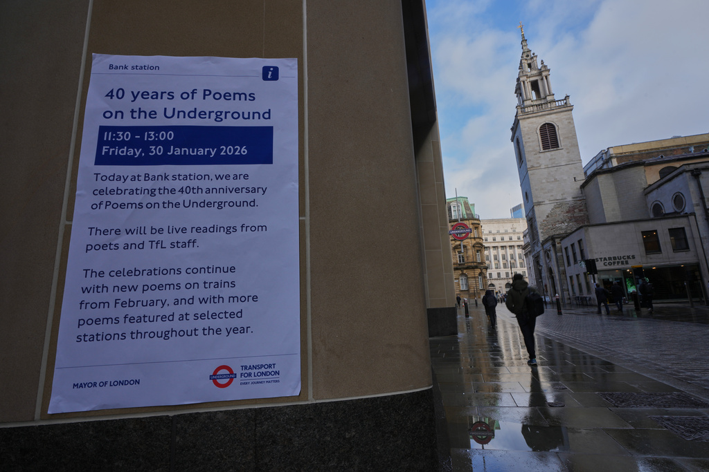 A poster advertising a gathering to celebrate 40 years of 'Poems on the Underground' in London, Friday, Jan. 30, 2026. (AP Photo/Kirsty Wigglesworth)