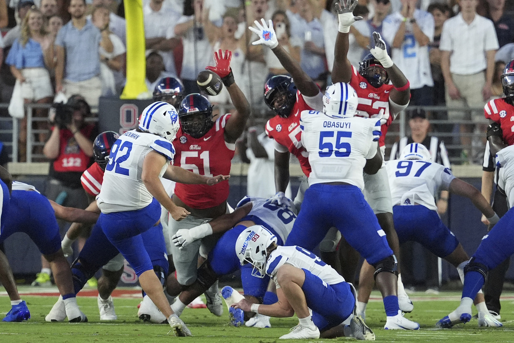 Mississippi defenders attempt to block a field goal attempt by Georgia State kicker Liam Rickman (92) during the first half of an NCAA college football game in Oxford, Miss., Saturday, Aug. 30, 2025. (AP Photo/Rogelio V. Solis)