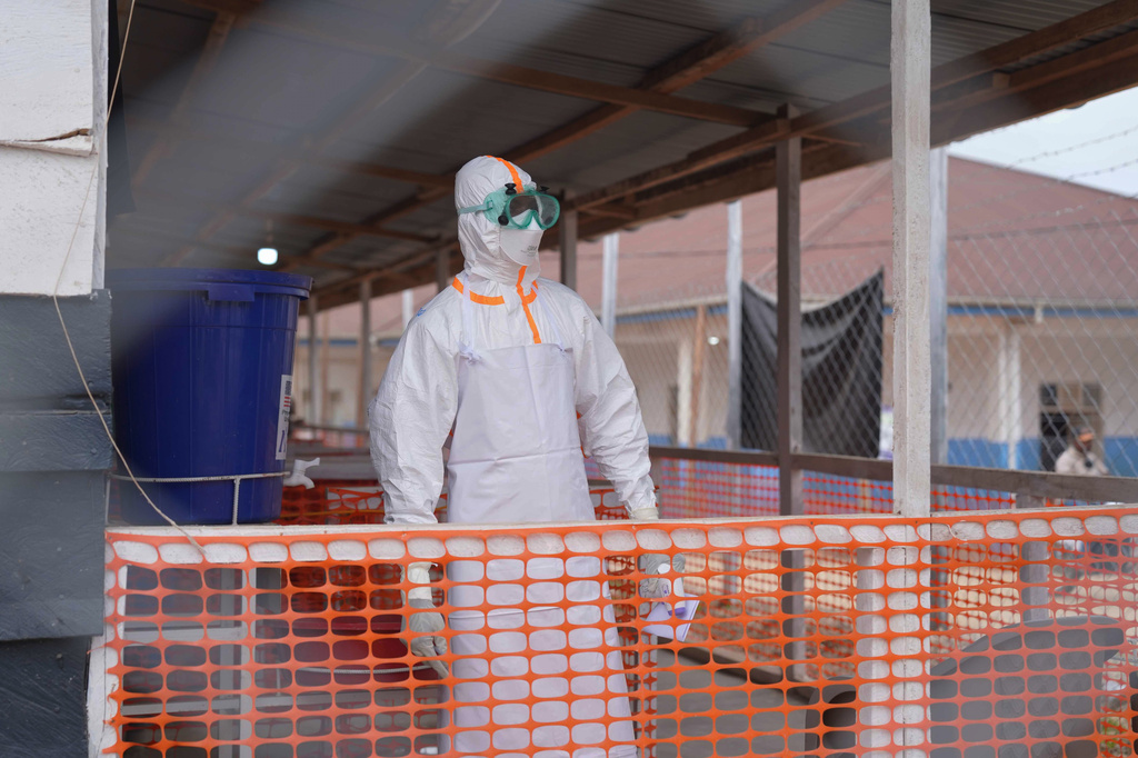 A health worker in protective gear looks on at an Ebola treatment centre in Bunia, Congo, Monday, Aug. 10, 2026. (AP Photo/Dieudonne Dirole)