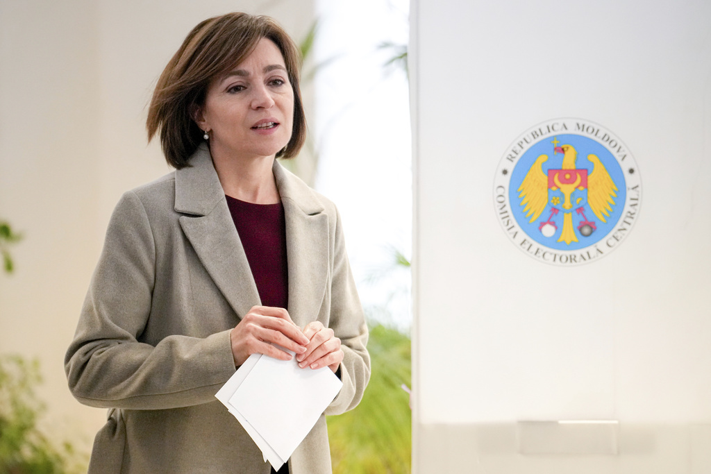 FILE - Moldova's President Maia Sandu exits a voting booth, in Chisinau, Moldova, Sunday, Oct. 20, 2024. (AP Photo/Vadim Ghirda, File)