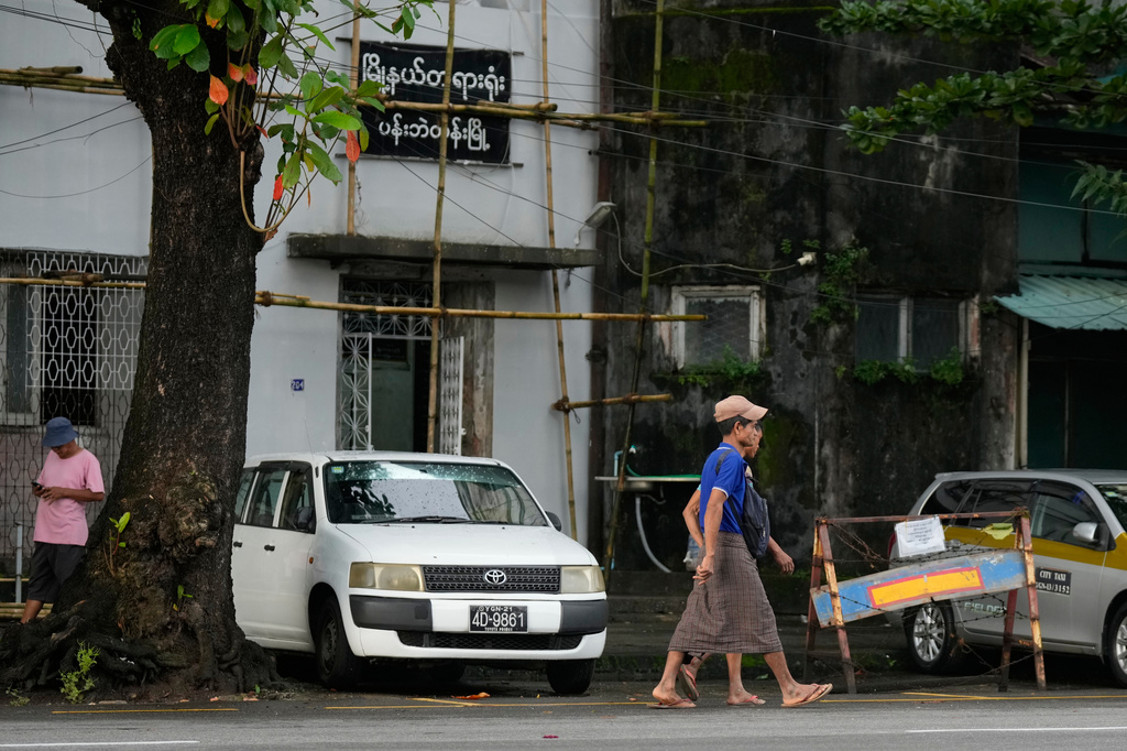 Pedestrians walk past near Pabaedan township court Tuesday, Sept. 15, 2026, in Yangon, Myanmar. (AP Photo)